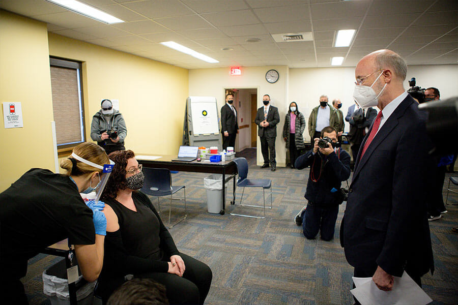Pennsylvania Governor Tom Wolf observes teachers being vaccinated at the Berks County IU vaccine site.